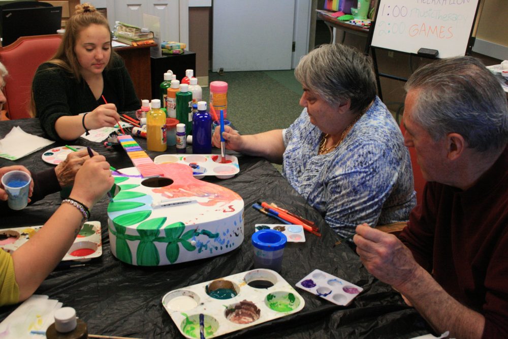 day program members painting Birch Bay Retirement Village Community